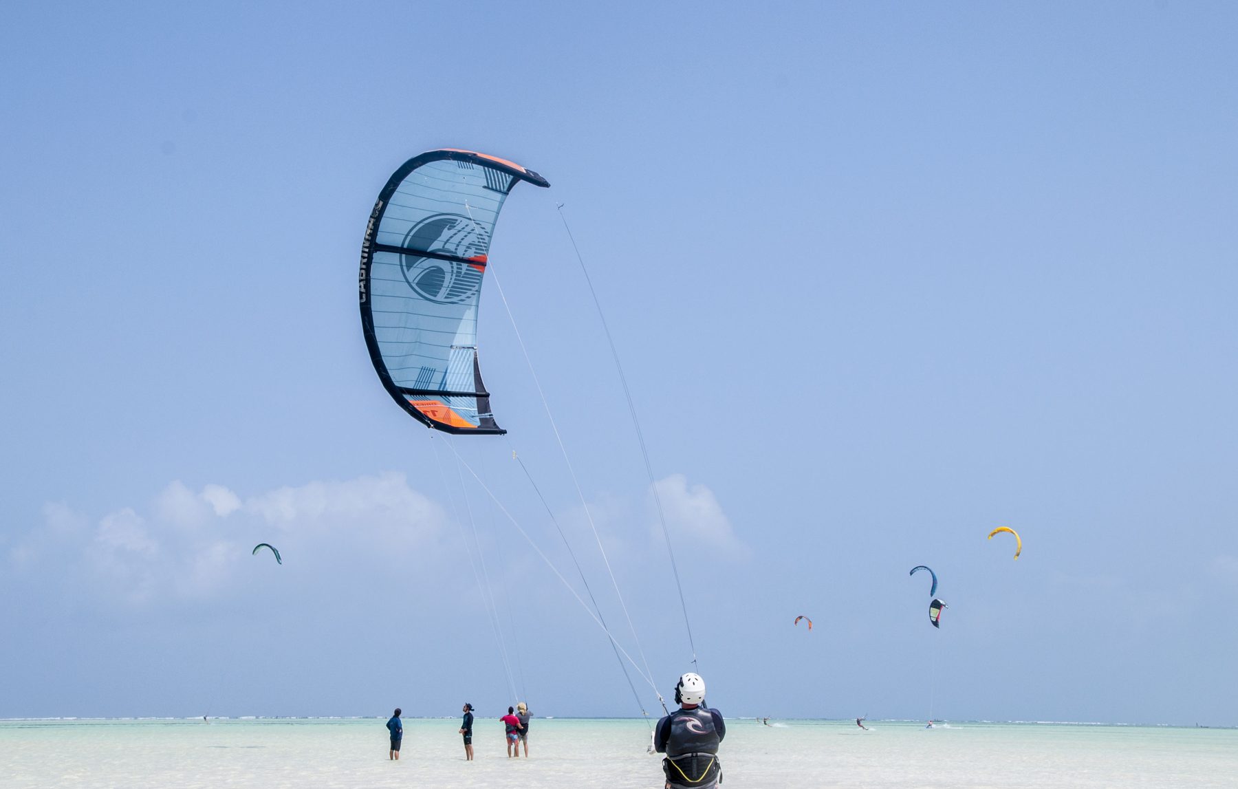 A kite surfer's canopy over the shallow turquoise water of Zanzibar