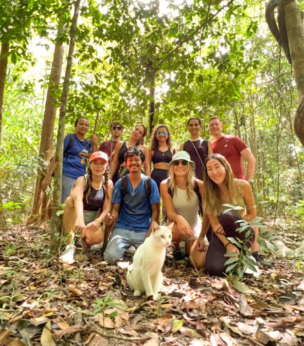 The TribeX group gathered together on a jungle trail after a hike